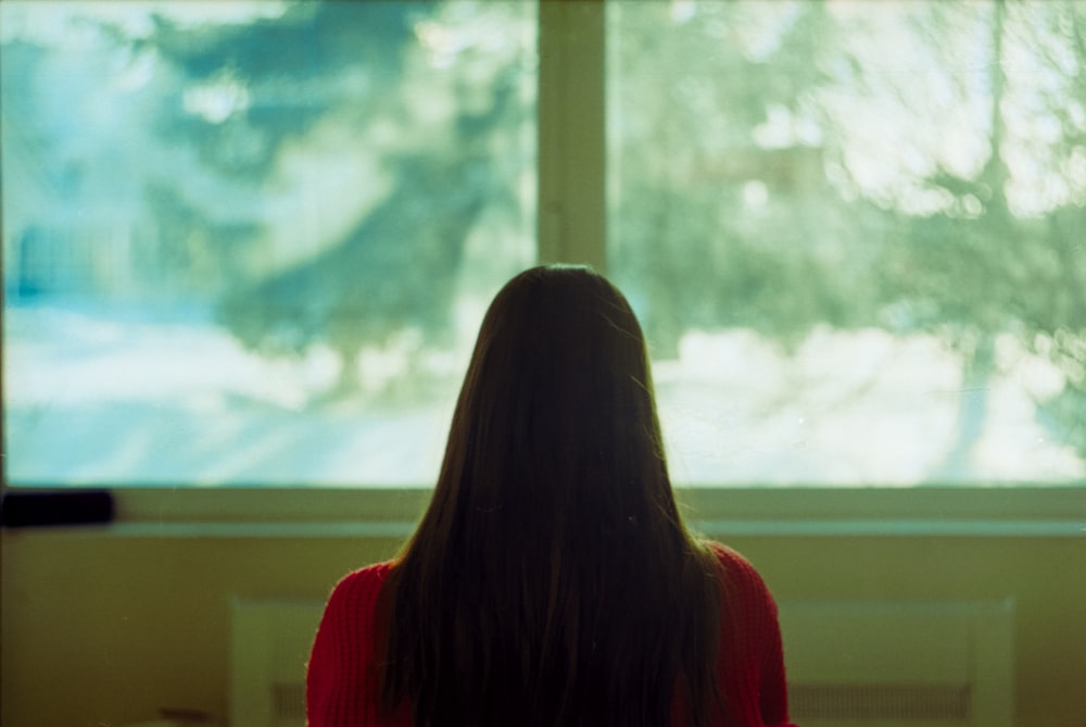 woman in red long sleeve shirt