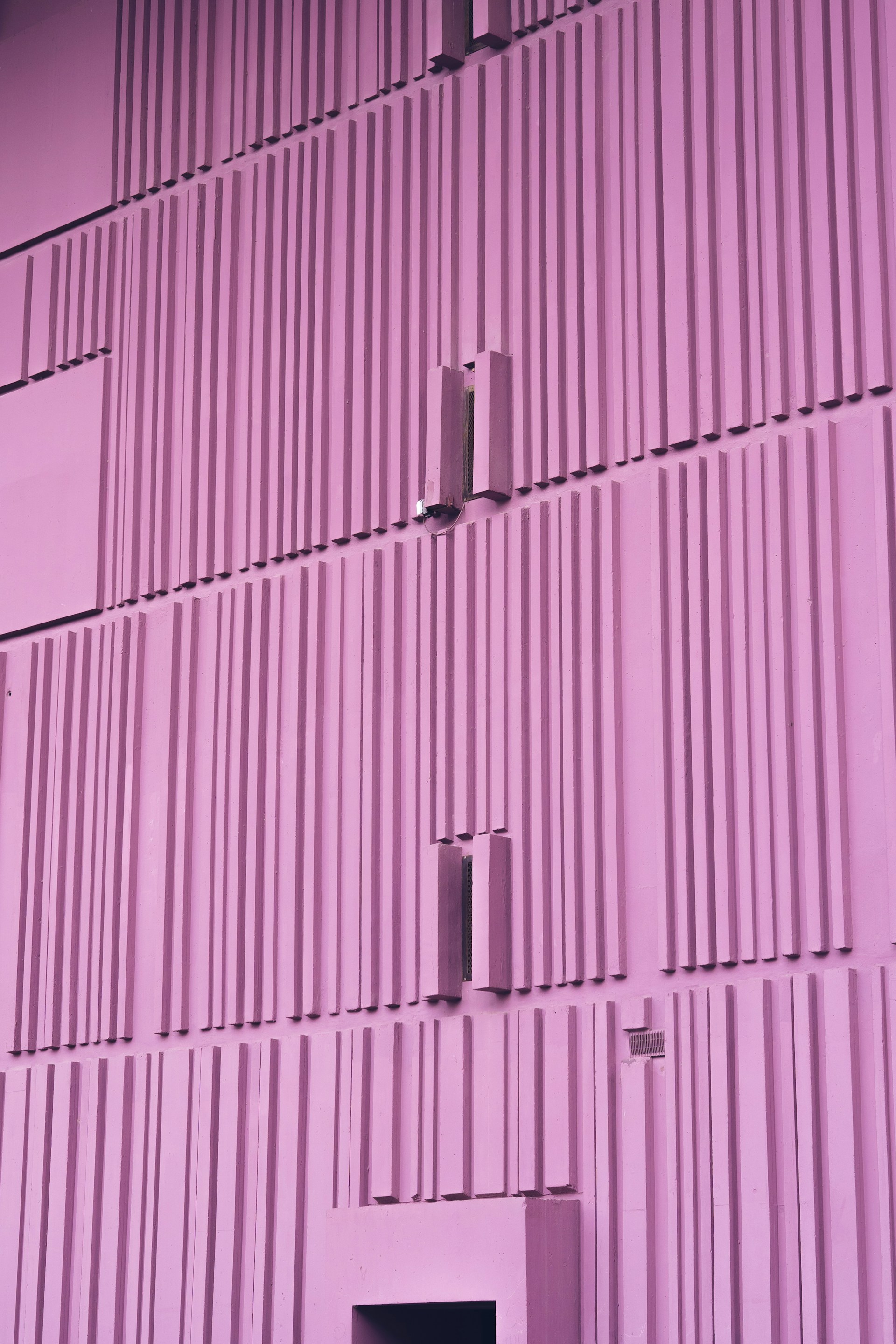 white light bulb on green wall