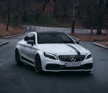 white mercedes benz coupe on road during daytime