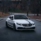 white mercedes benz coupe on road during daytime