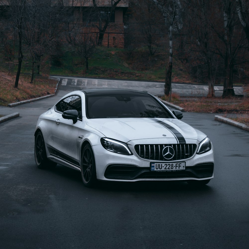 white mercedes benz coupe on road during daytime