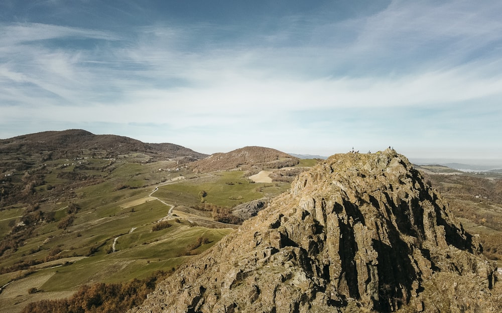 brown and green mountain under blue sky during daytime