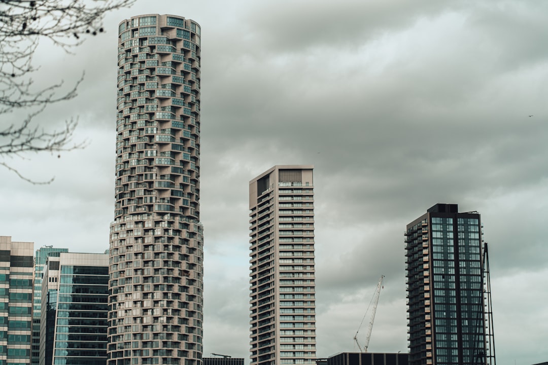 brown and gray high rise building under gray sky