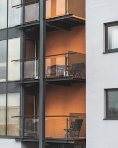 Photo of a friendly real estate agent showing a client a modern apartment in Belo Horizonte.