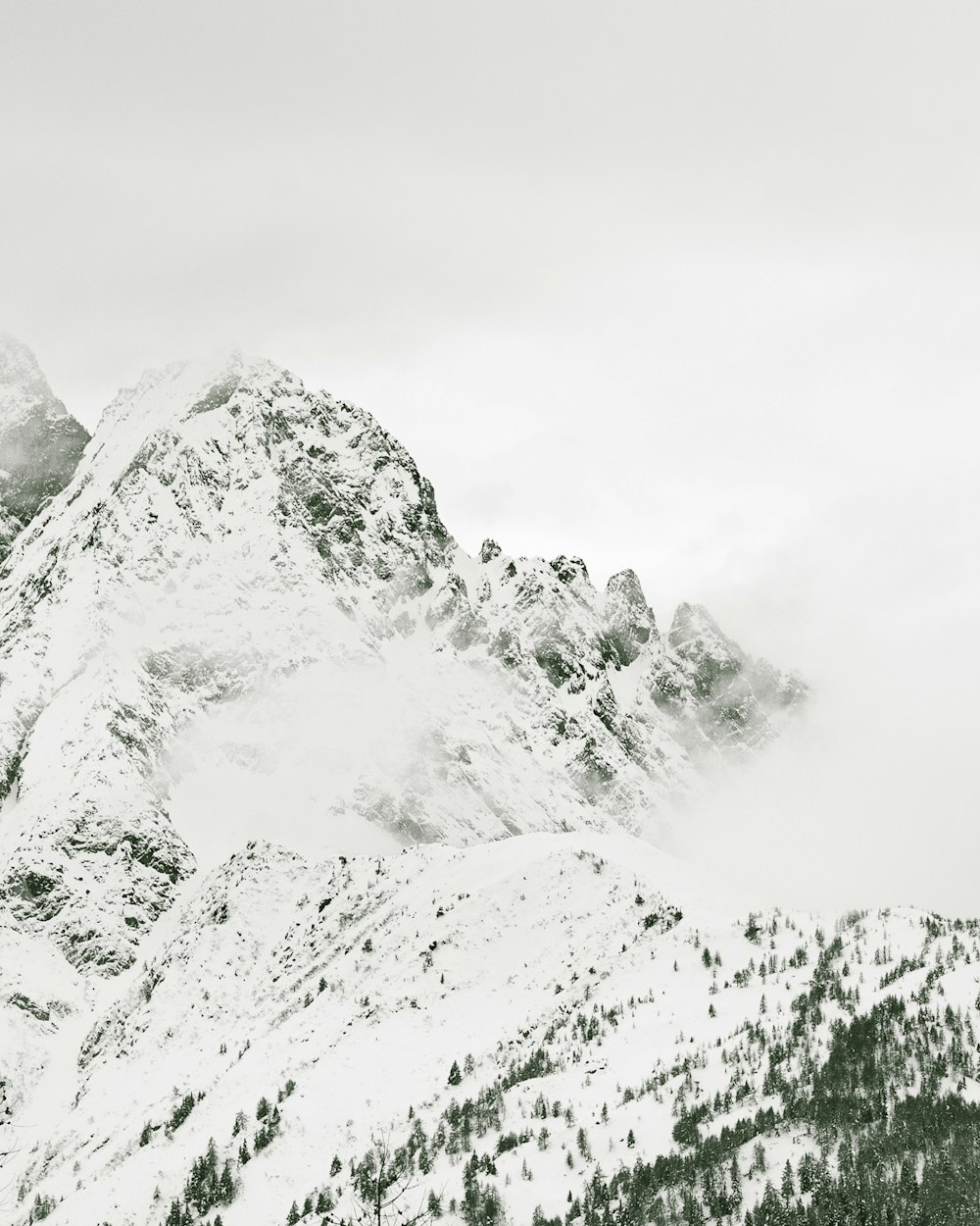 snow covered mountain during daytime