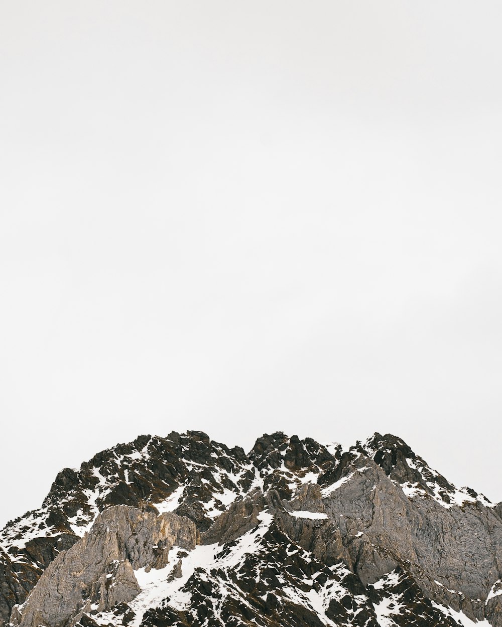 rocky mountain under white sky during daytime photo – Free Via petrarca  Image on Unsplash