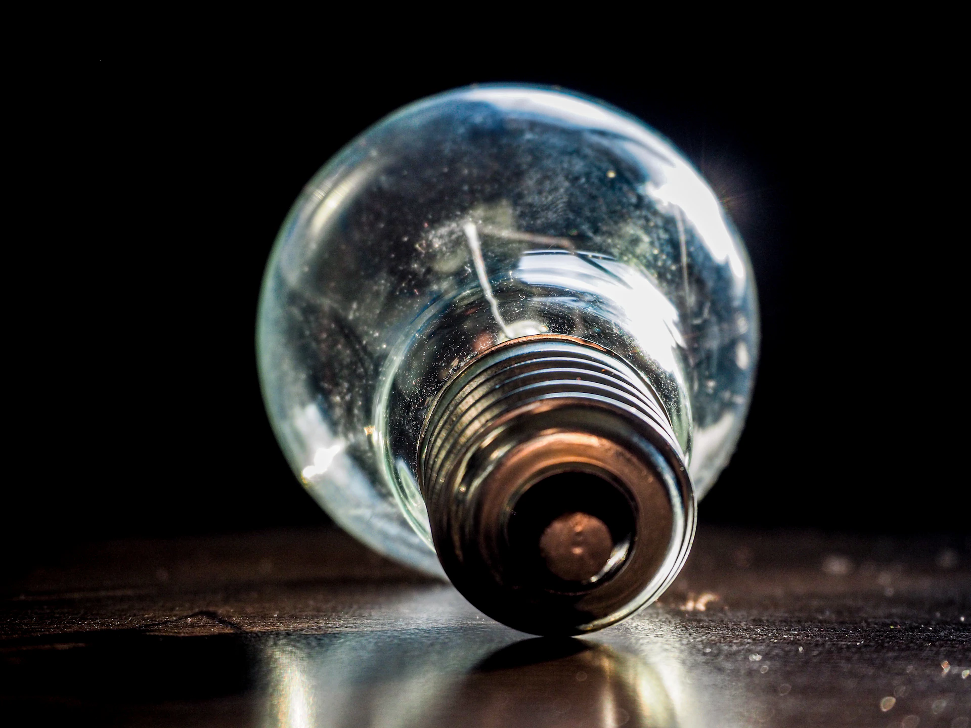 clear glass ball on brown wooden table