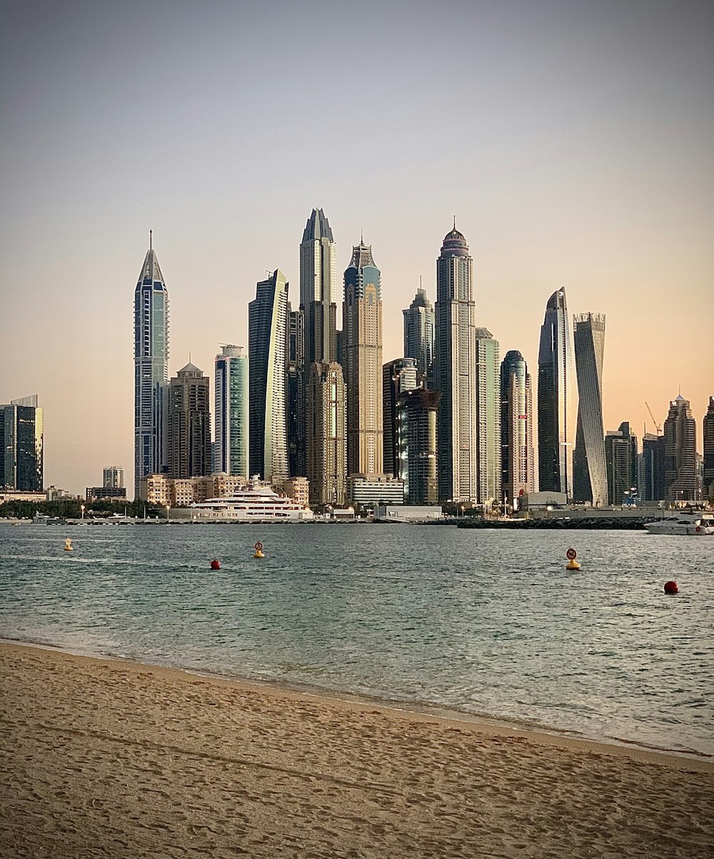 city skyline across body of water during daytime