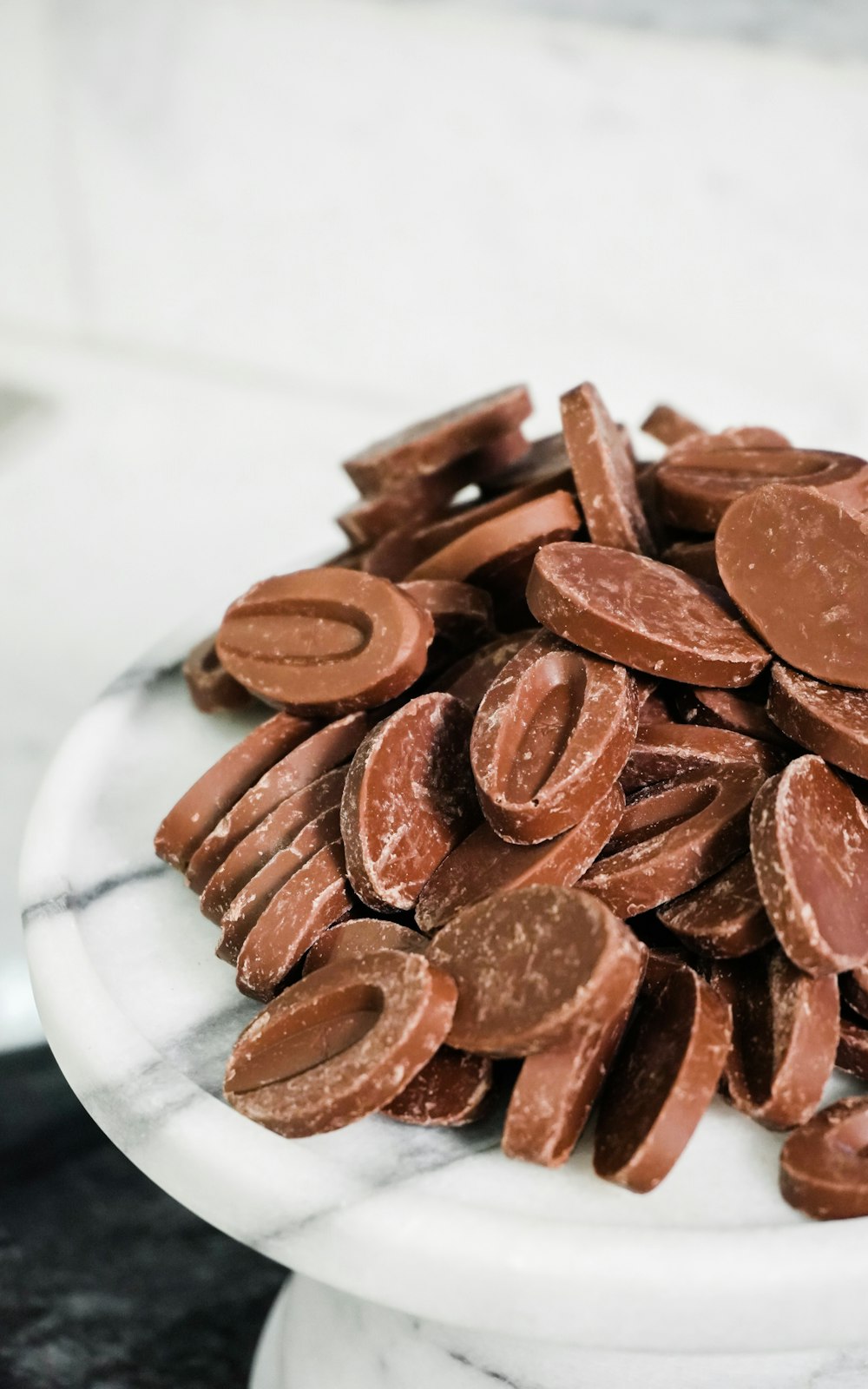 brown round cookies on white ceramic plate