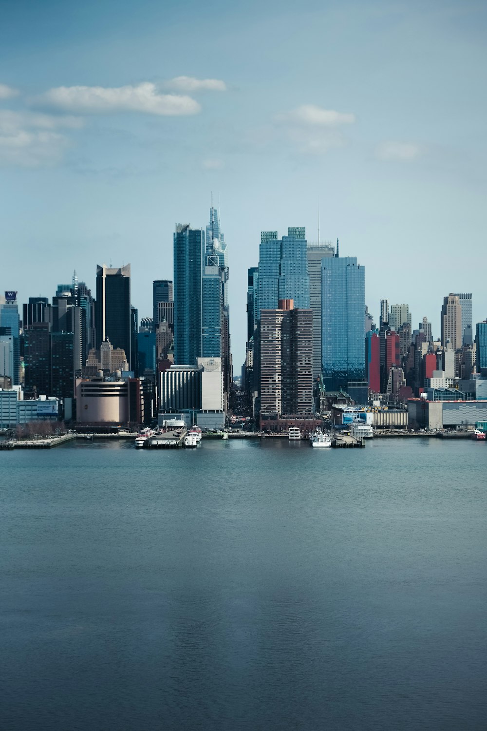 city skyline across body of water during daytime