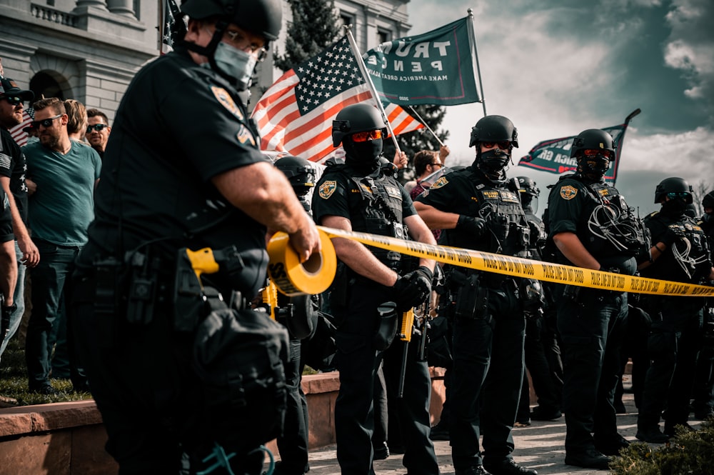 man in black shirt holding american flag