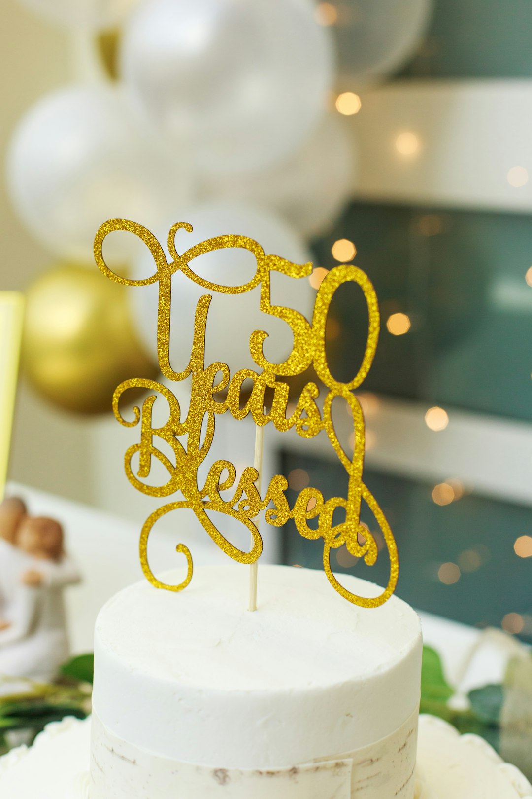 gold love freestanding letters on white table