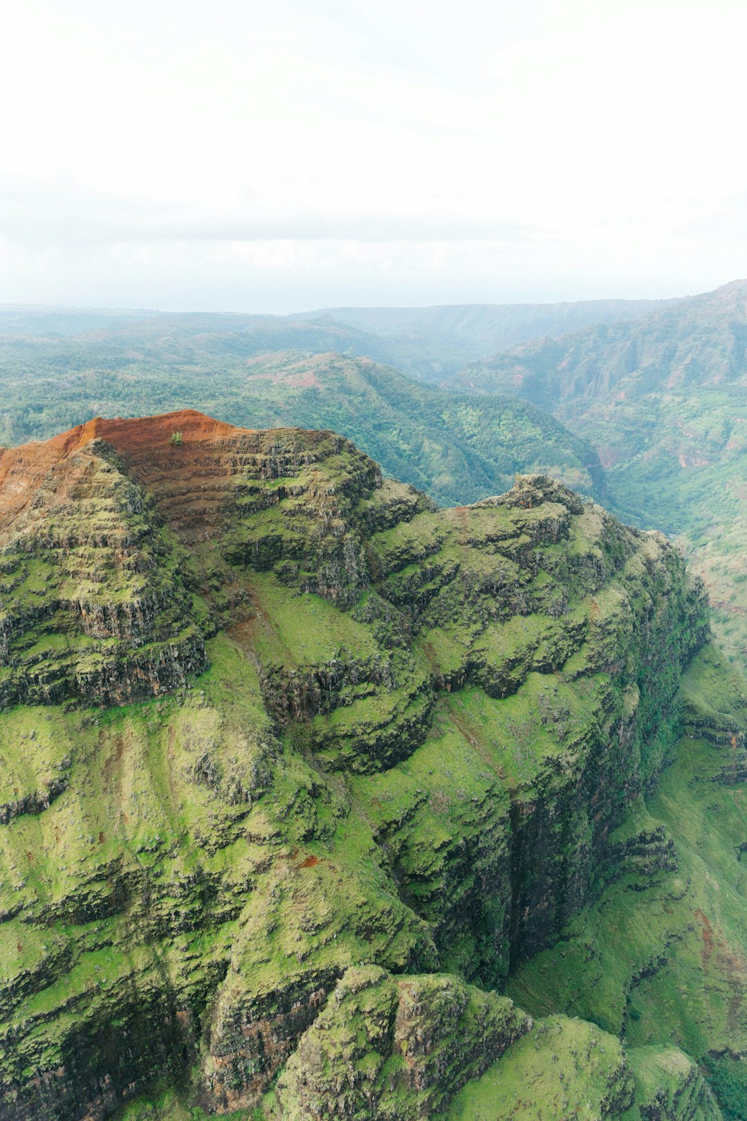 green mountains under white sky during daytime