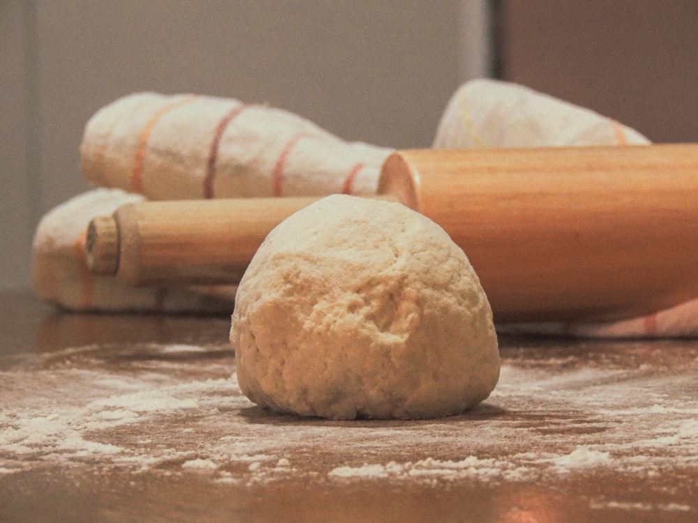 white dough on brown wooden table