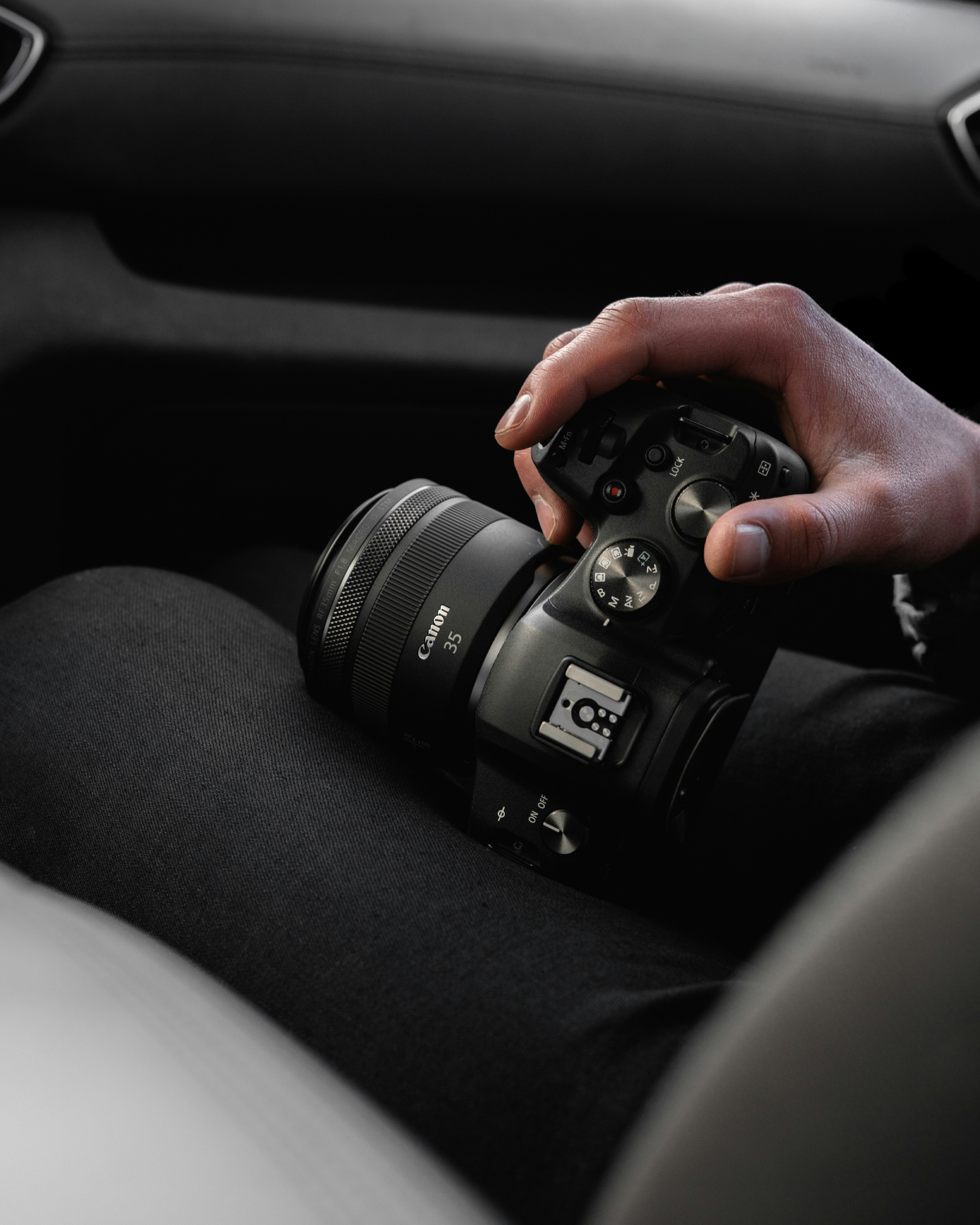 person holding black nikon dslr camera