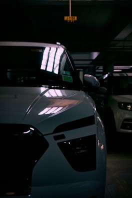 Close-up of polished chrome parts reflecting the garage lights.