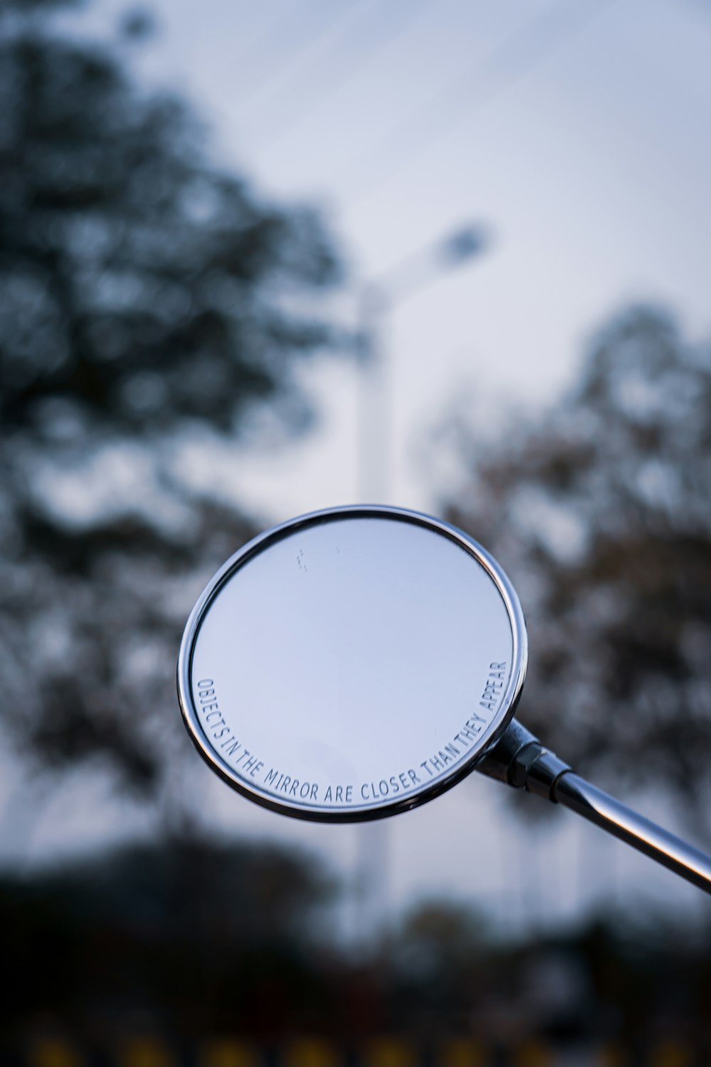 white magnifying glass in grayscale photography