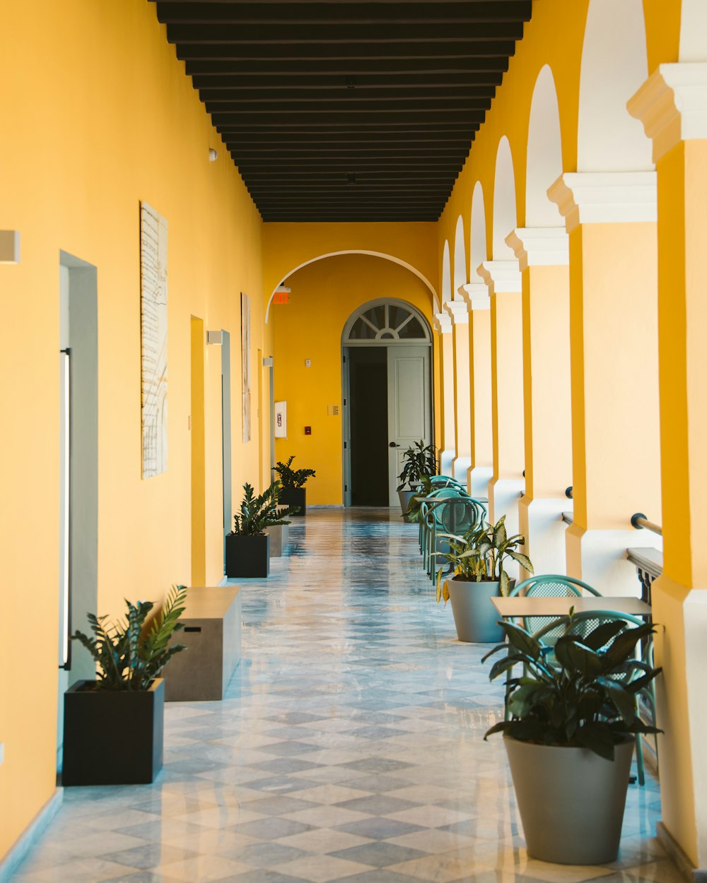 white chairs and table on hallway