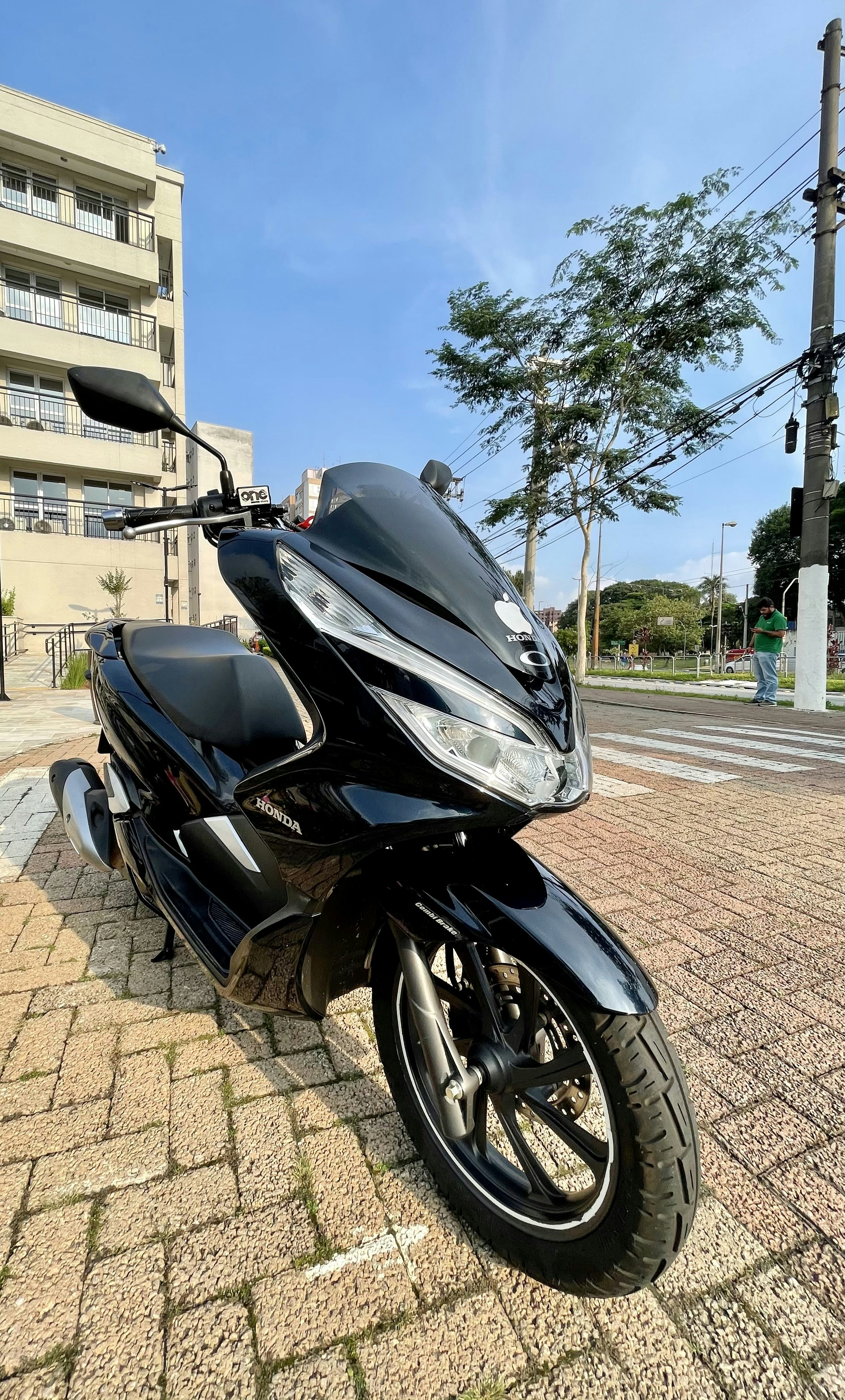 Honda scooter in modern urban environment, clean minimalist composition