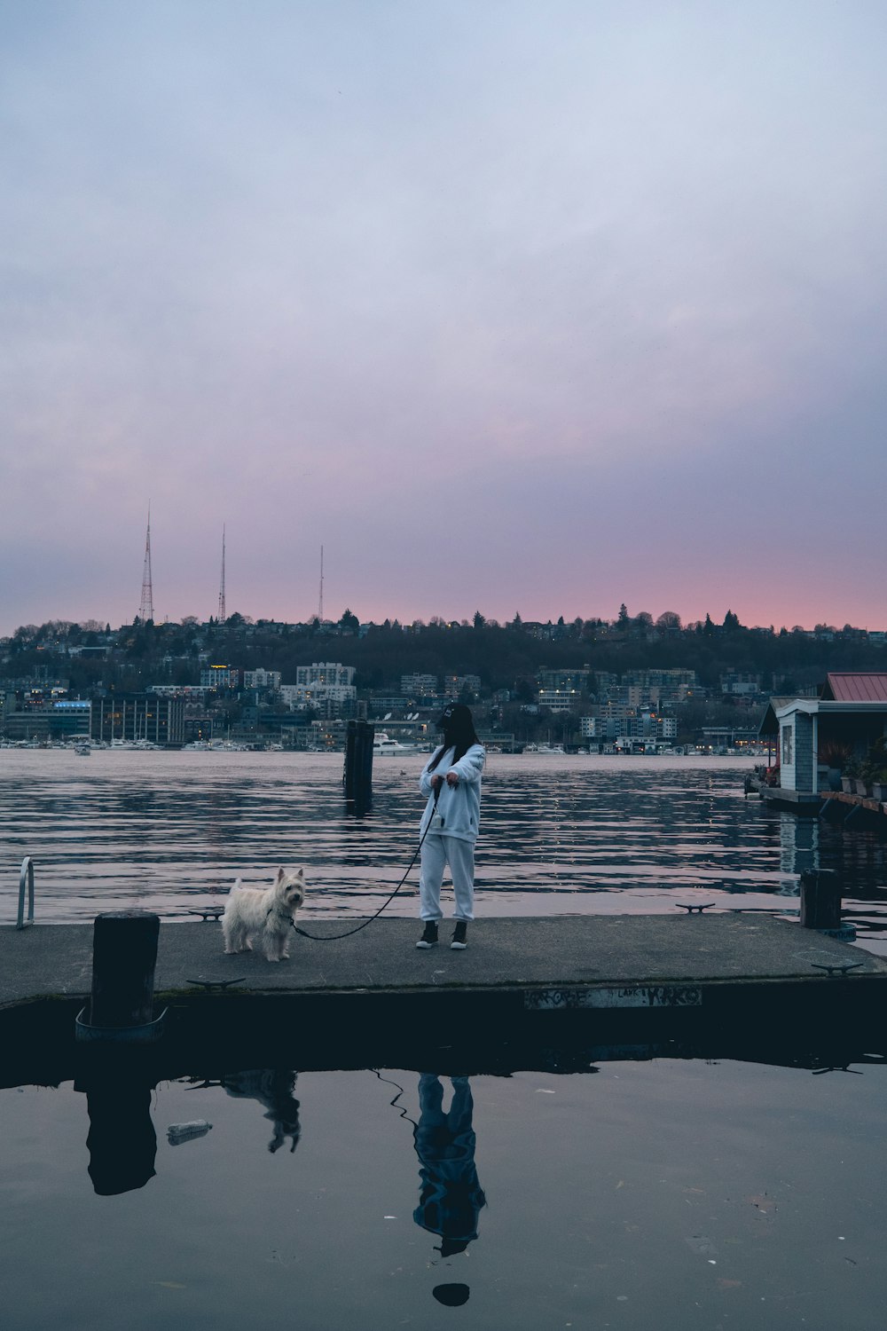 man and woman standing on dock during daytime