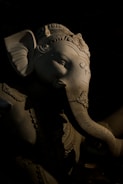 Close-up of a detailed elephant sculpture with intricate carvings.