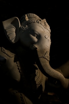 Close-up of a detailed elephant sculpture with intricate carvings.