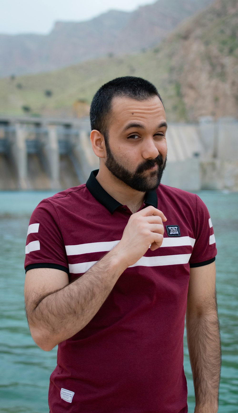 man in red and white adidas crew neck t-shirt