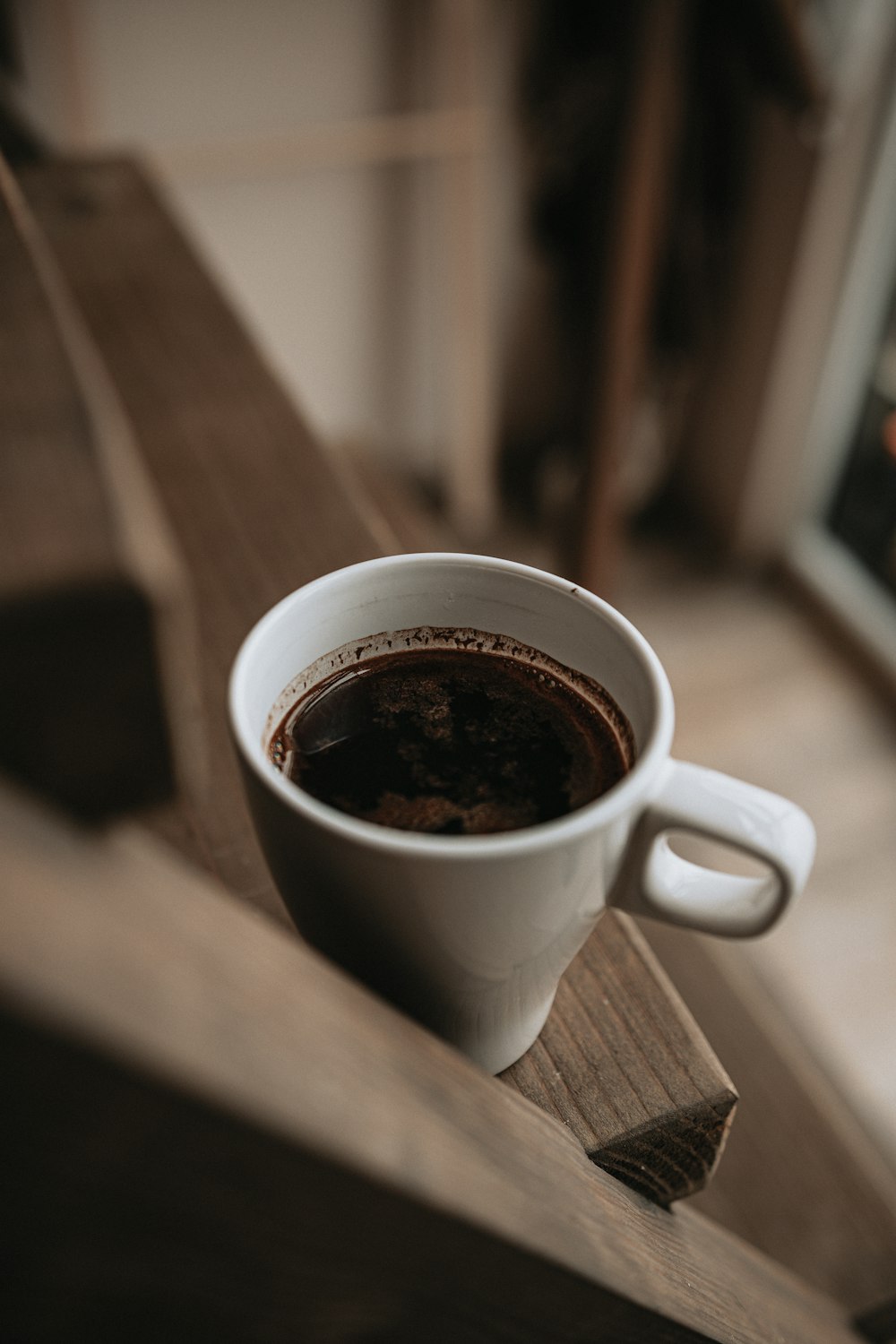 white ceramic mug with coffee