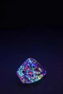 A detailed 3D model glowing with translucent emerald highlights against a dark background.