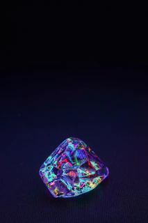 Luminous emerald showcasing its natural inclusions against a sleek black background