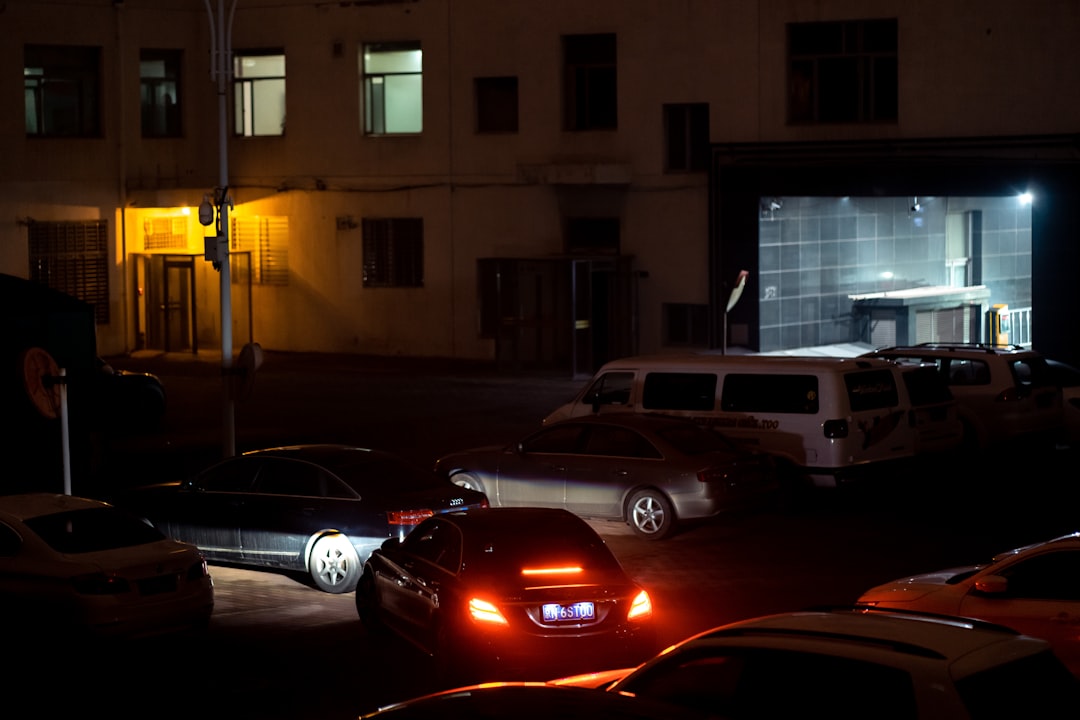 cars parked in front of building during night time