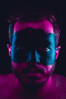 man with black and brown face paint
