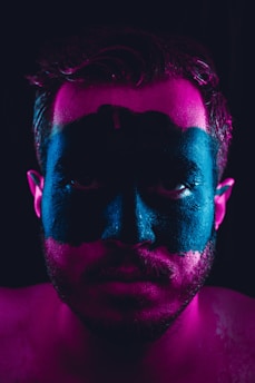 man with black and brown face paint
