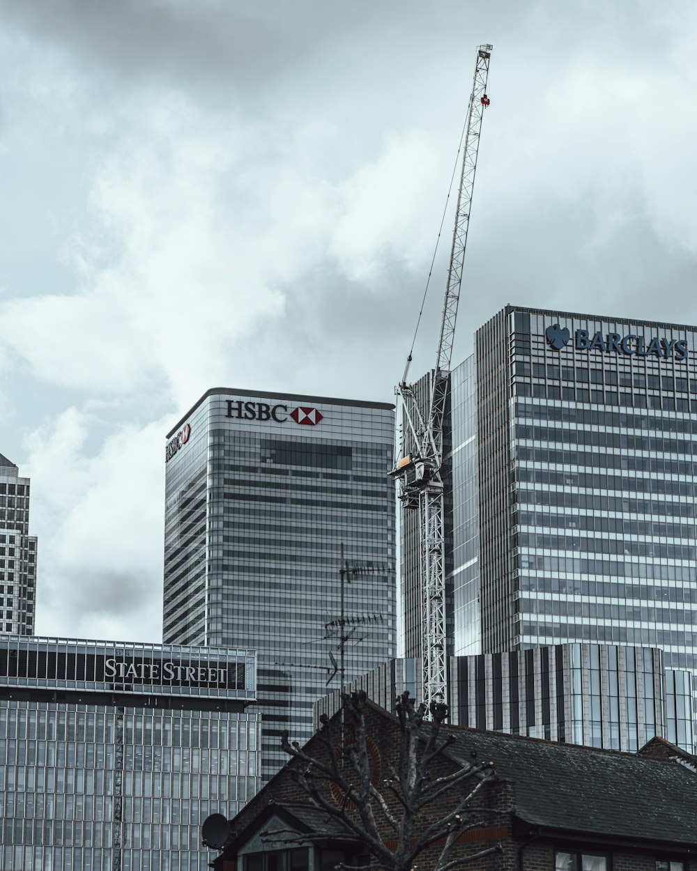 white and black concrete building under white sky during daytime