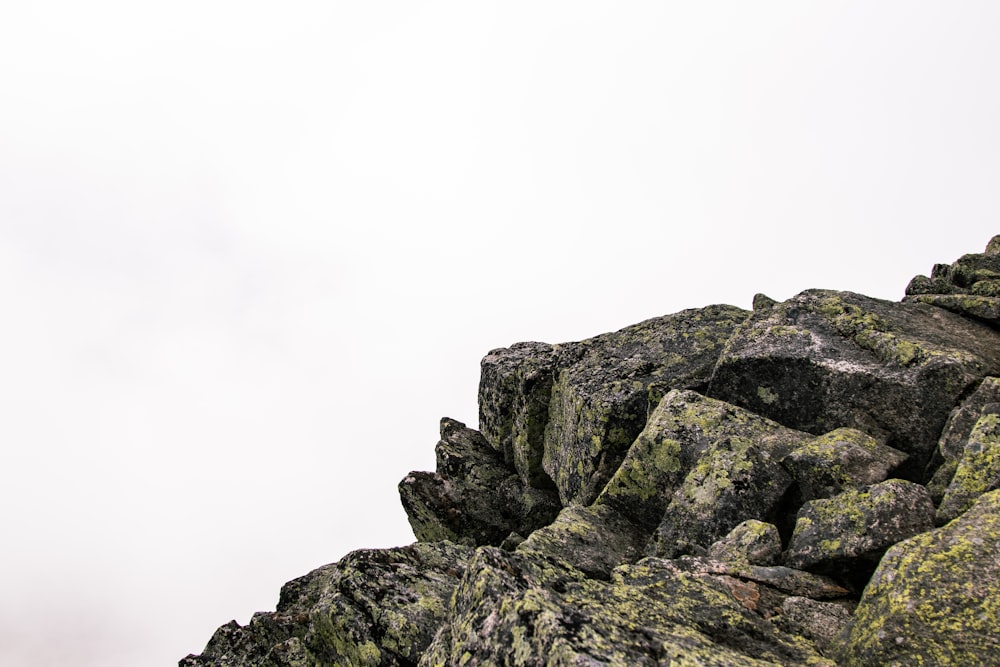 gray rocky mountain under white sky during daytime