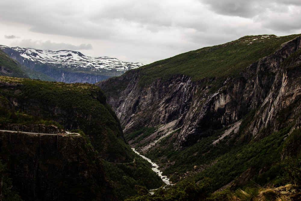 green and brown mountains under white clouds during daytime