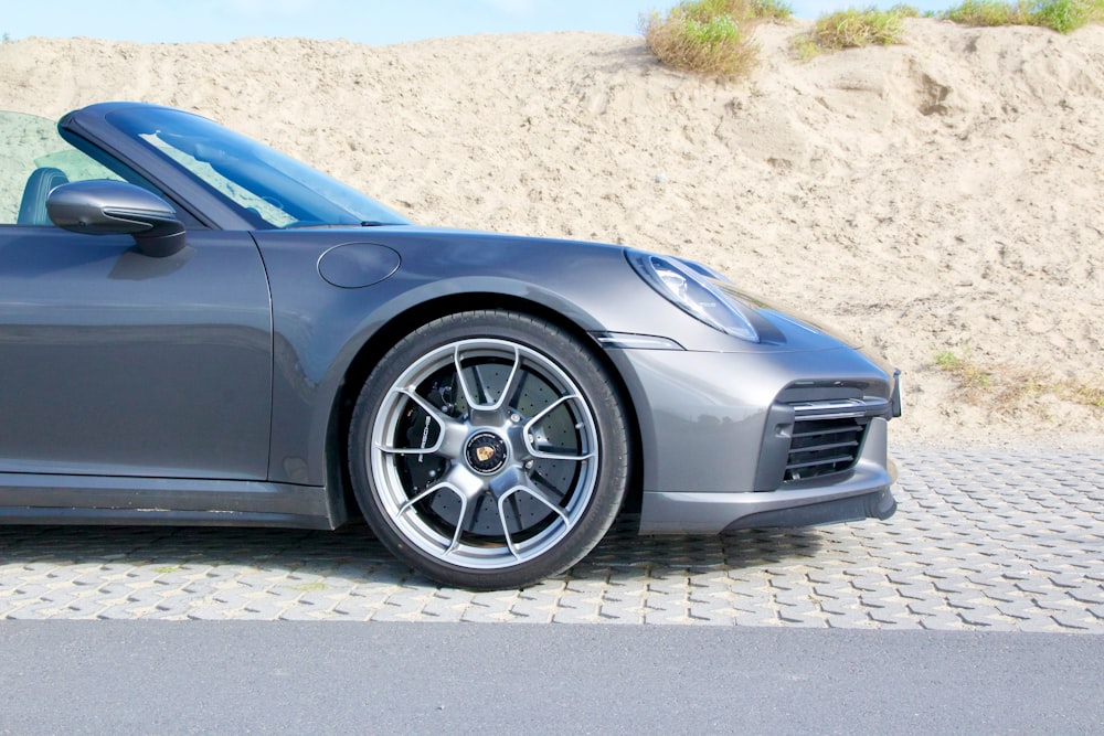 blue car on gray concrete road