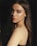 woman in black top with black background