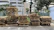 Stacks of wooden pallets neatly organized outside a Texas business, ready for recycling pickup.