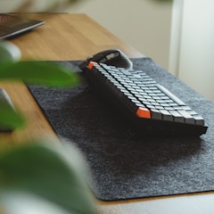 black and white computer keyboard on black table