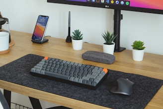 black computer keyboard on brown wooden table