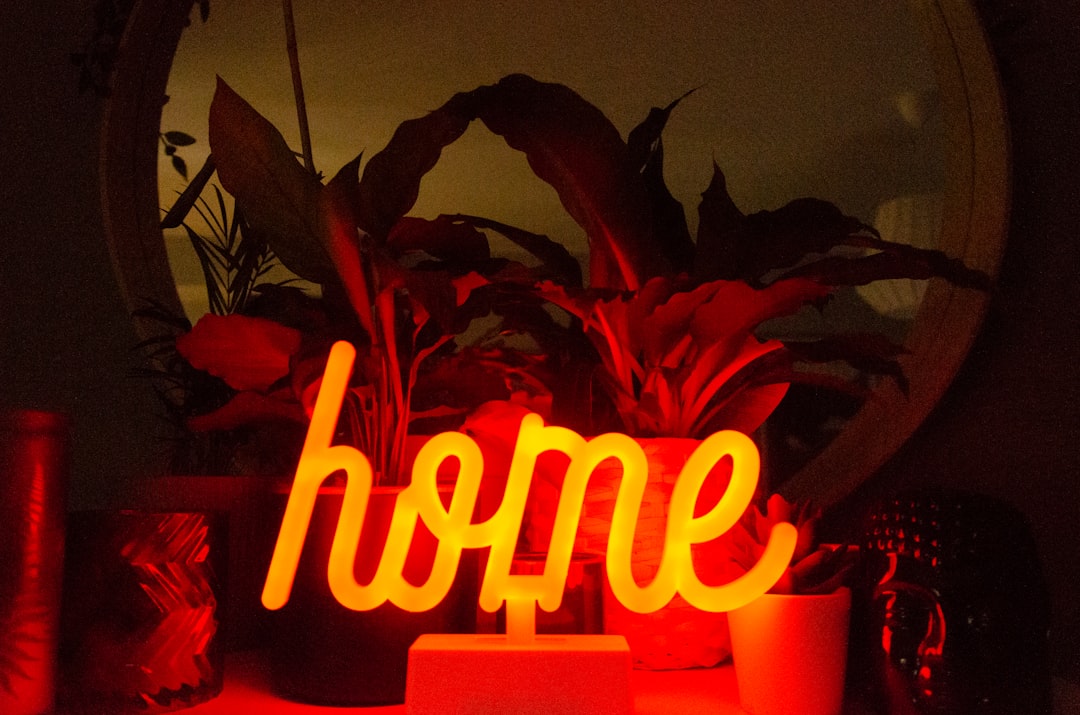 Home written in orange neon