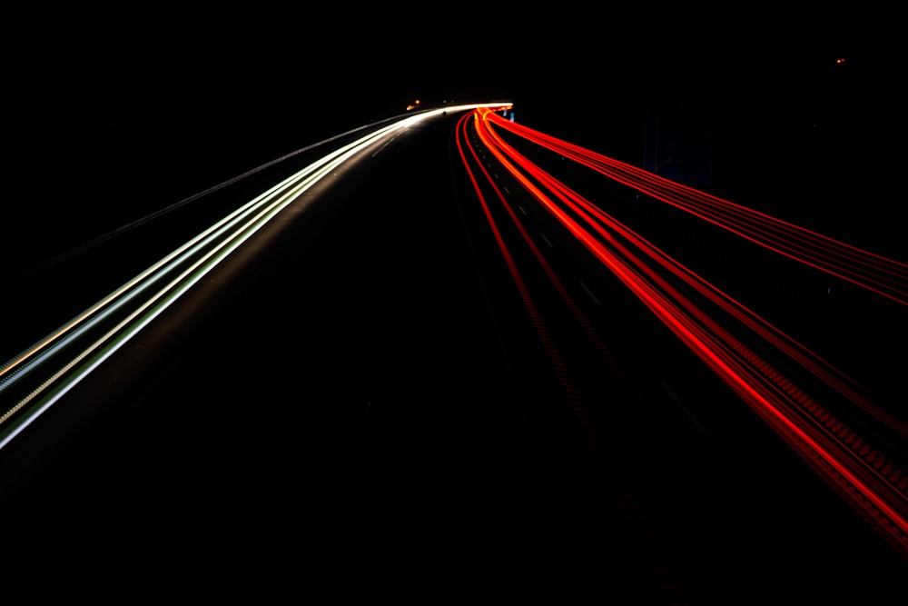 time lapse photography of cars on road during night time