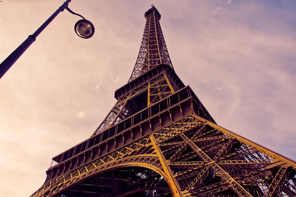 eiffel tower under white clouds during daytime