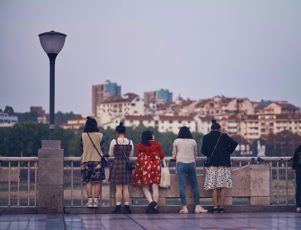 people standing on gray concrete floor during daytime