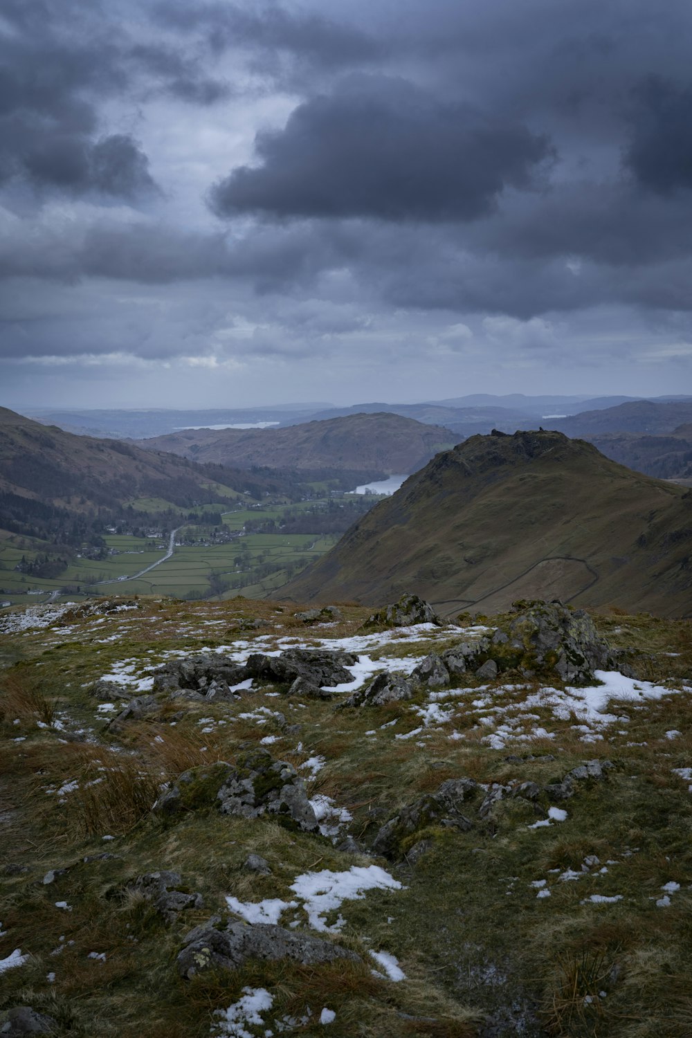 green and brown mountains under white clouds during daytime