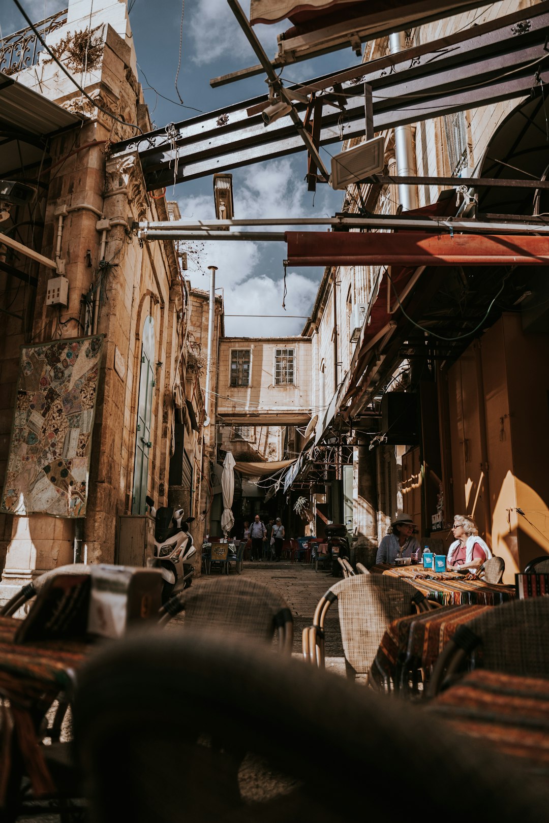 cars parked beside building during daytime