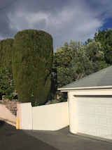 A fully installed garage door opening smoothly in a quiet Orlando neighborhood.