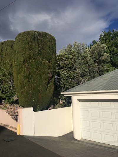 A technician carefully installing a new residential garage door in a Baltimore home.