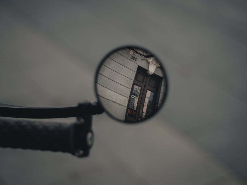 black magnifying glass on white surface